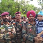 Abhinav, son of Lance Naik Sandeep Singh with the CO of his battalion