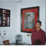 Capt Manoj Kumar's son Aradhye Ackshatt with his dad's portrait.