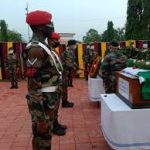 Army personnel pay their last respects to Lt Col Robert TA Kuba