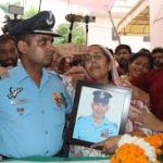 People paying trubutes to Sqn Ldr Lokendra Singh Sindhu.
