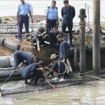 Navy personnel conducting salvage operation of INS Sindhurakshak