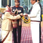 Shri K. Radhakrishnan receiving Ashoka Chakra Awarded to his son Capt. Harshan R (Posthumous) from the President, Smt. Pratibha Devisingh Patil, during the 59th Republic Day Parade-2008