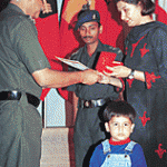 Mrs Poonam Guleria wife of Capt Deepak Guleria being felicitated by the Army Officials